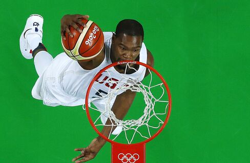 An overview shows USA's guard Kevin Durant scoring during a Men's round Group A basketball match between USA and Venezuela at the Carioca Arena 1 in Rio de Janeiro on August 8, 2016 during the Rio 2016 Olympic Games. / AFP / POOL / Jim YOUNG (Photo credit should read JIM YOUNG/AFP/Getty Images)