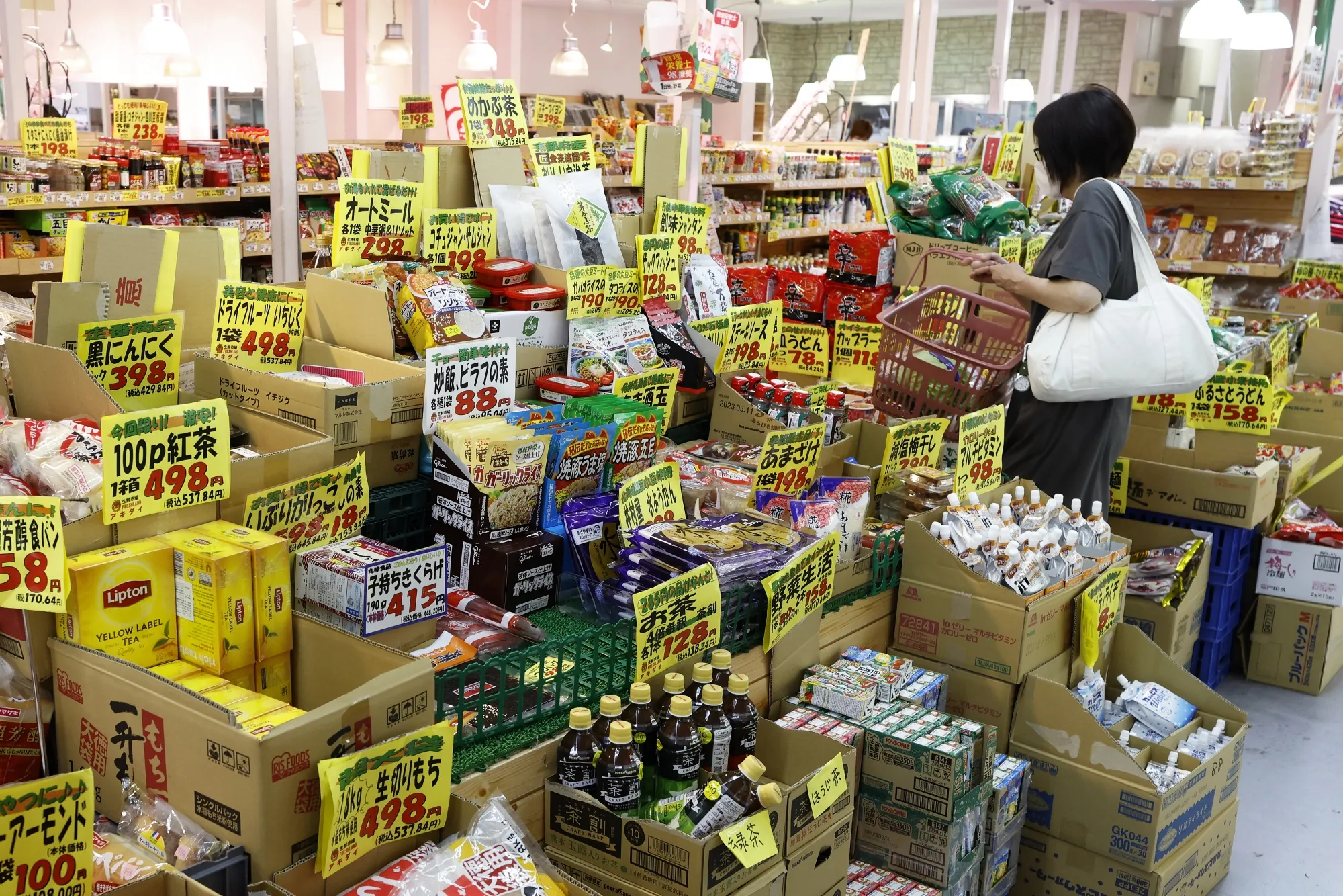 A customer shops at a supermarket in Tokyo, Japan, on June 27.