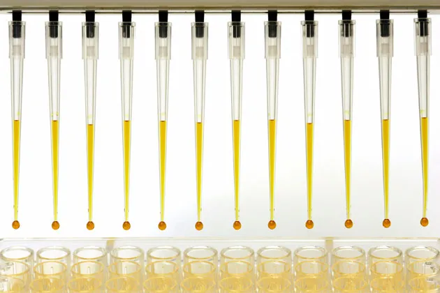 Robotic automated arm handling liquids for DNA amplification