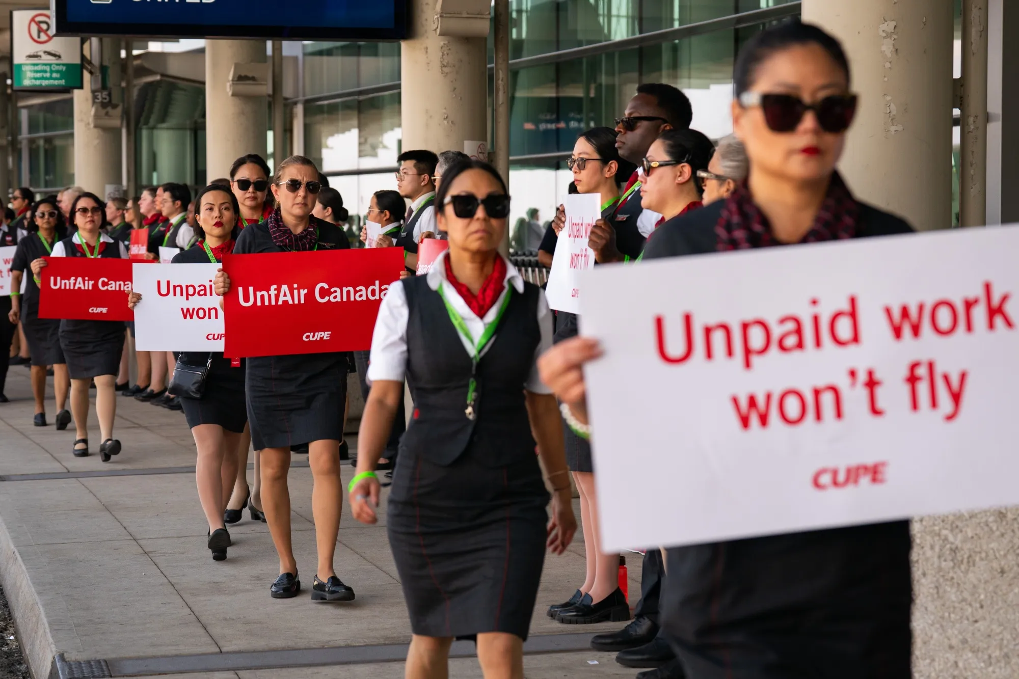Air Canada flight attendants during a demonstration at Toronto Pearson International Airport in Mississauga, Ontario, on&nbsp;Aug. 11.