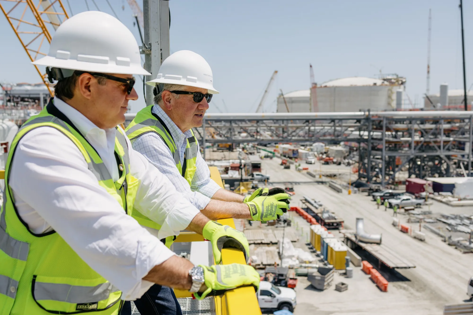 Mike Sabel and Bob Pender at the company’s Plaquemines LNG plant while under construction in Port Sulphur, Louisiana.