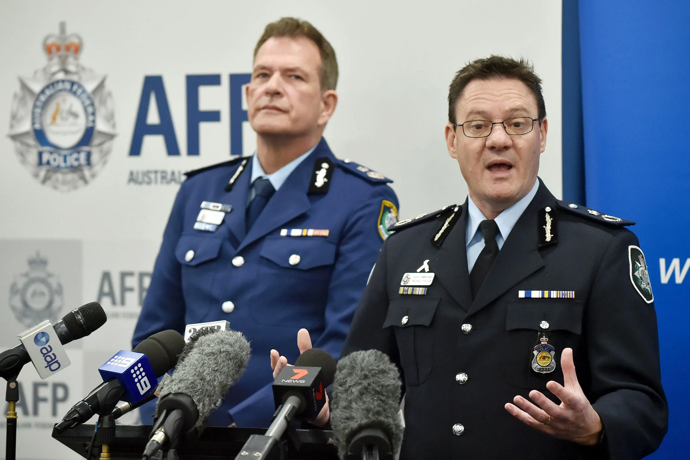 Australian Federal Police Deputy Commissioner Michael Phelan, right, speaks to the media beside New South Wales Police Deputy Commissioner David Hudson at a press conference in Sydney on Aug. 4.
