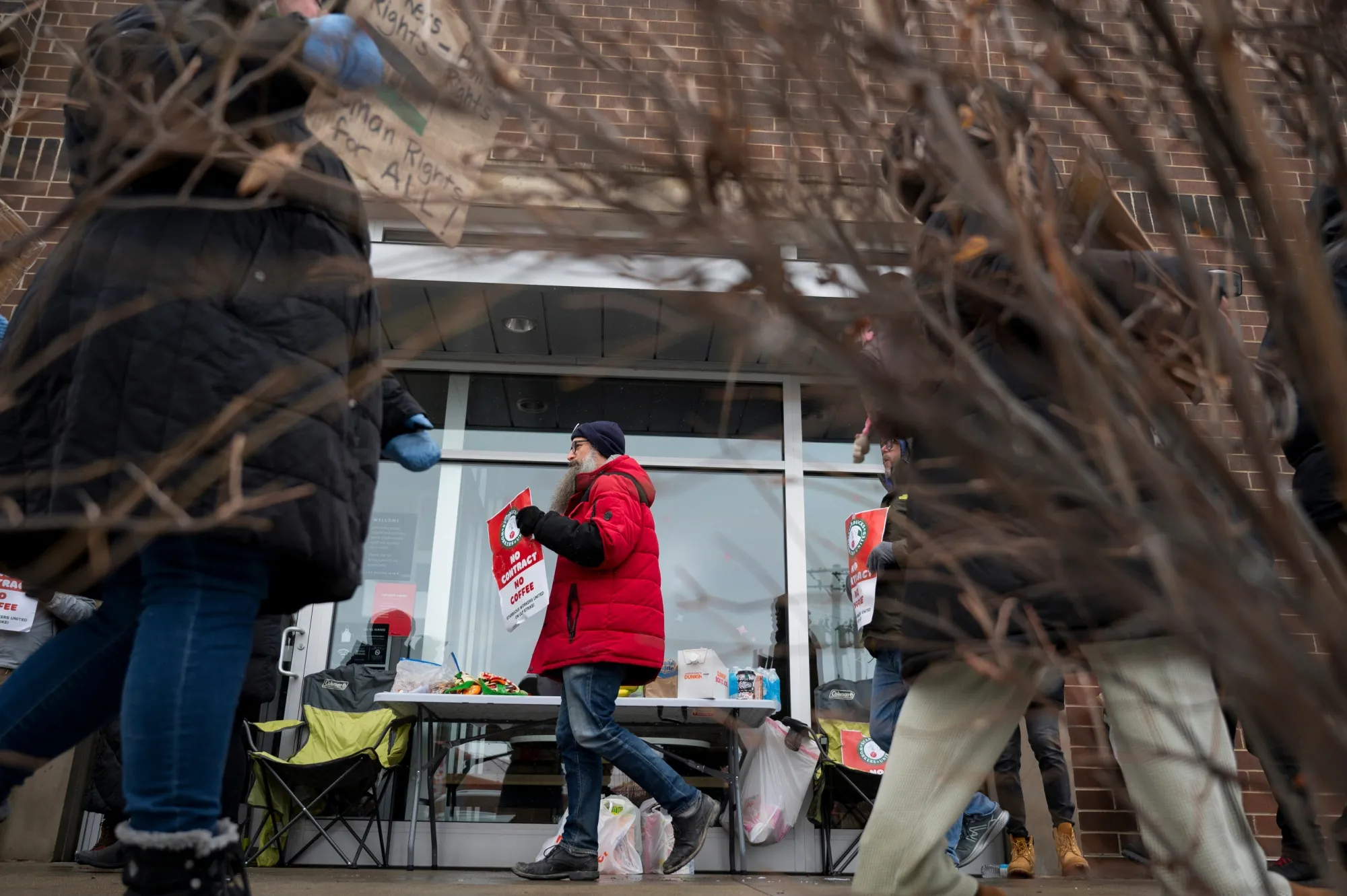 Starbucks Workers United members picket outside a Starbucks in Chicago in 2024. New strikes are planned for Thursday.&nbsp;