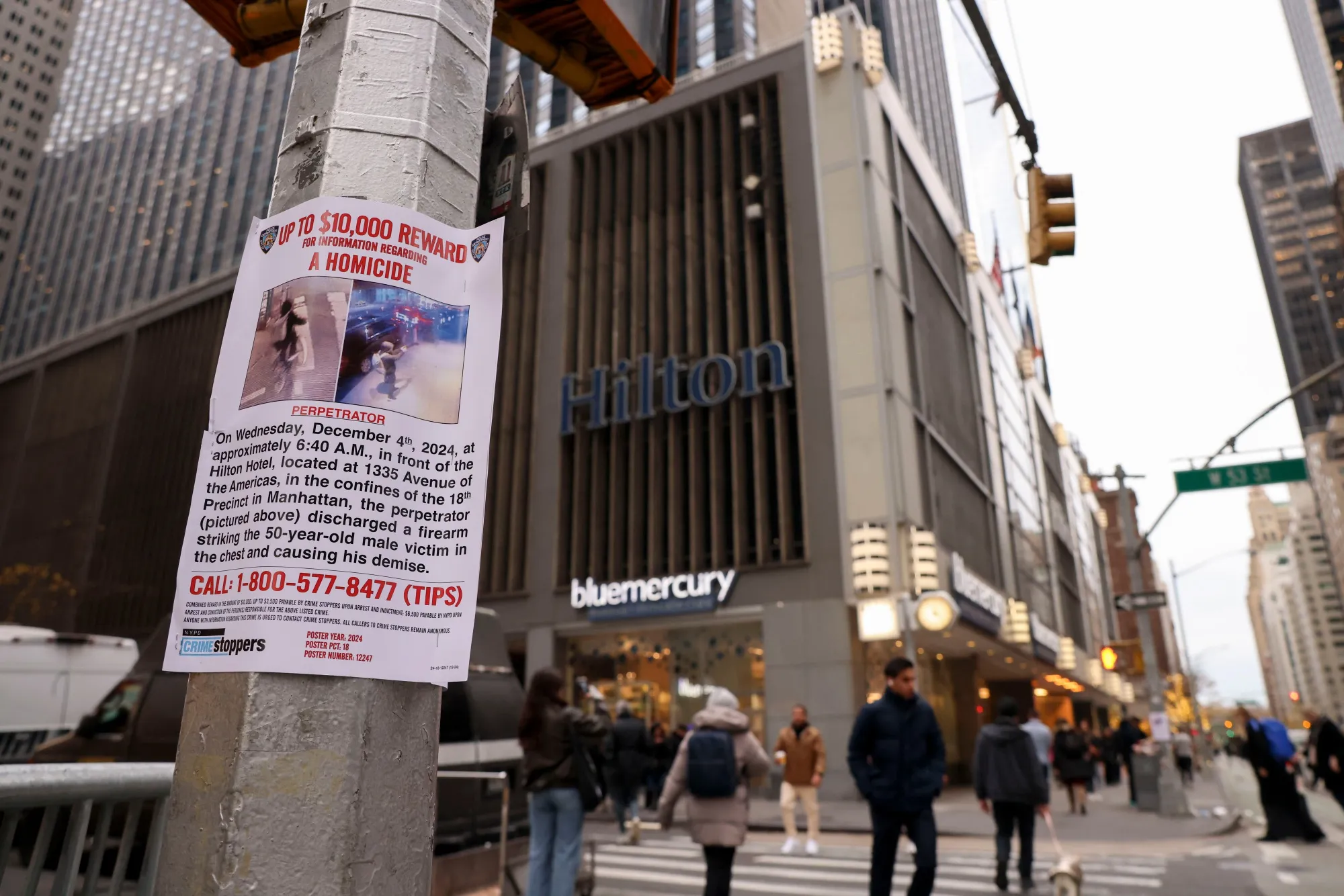 A New York Police Department (NYPD) flier outside the New York Hilton Midtown seeking information on the Dec. 4 shooting of UnitedHealth Group Inc. executive Brian Thompson.
