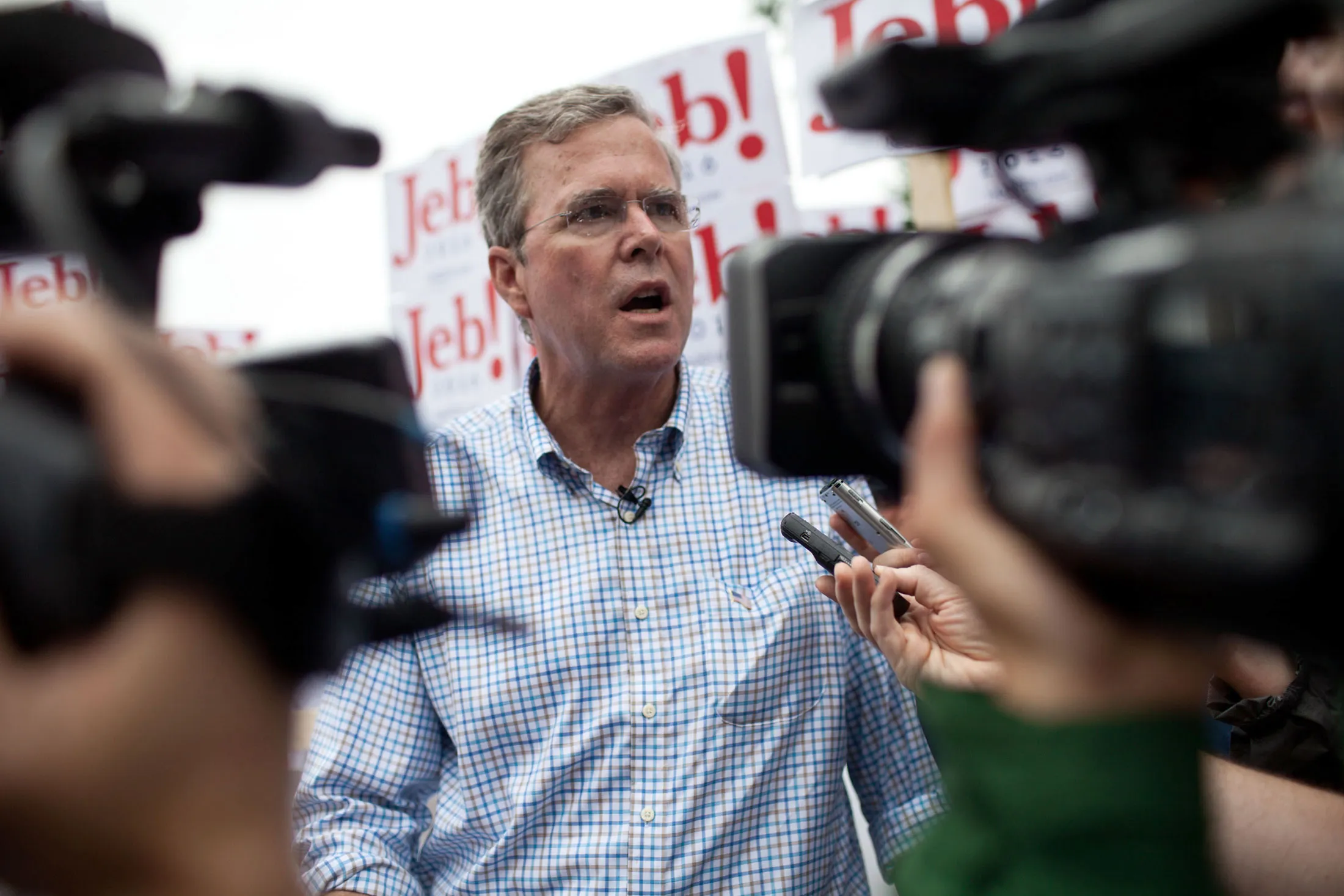 Republican Presidential candidate Jeb Bush speaks to the press at the 4th of July Parade in Merrimack, New Hampshire.
