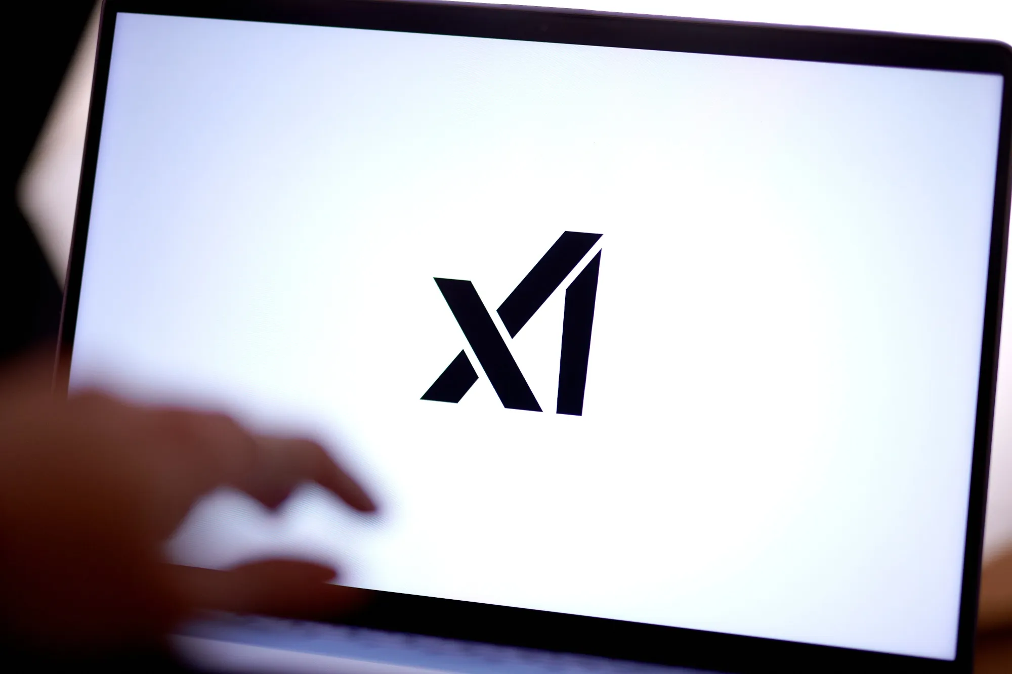 The xAI logo on a laptop. The AI startup run by Elon Musk was a bright spot for VC funding in the quarter.