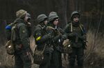 Ukrainian servicemen&nbsp;north of Kyiv on Feb. 24.