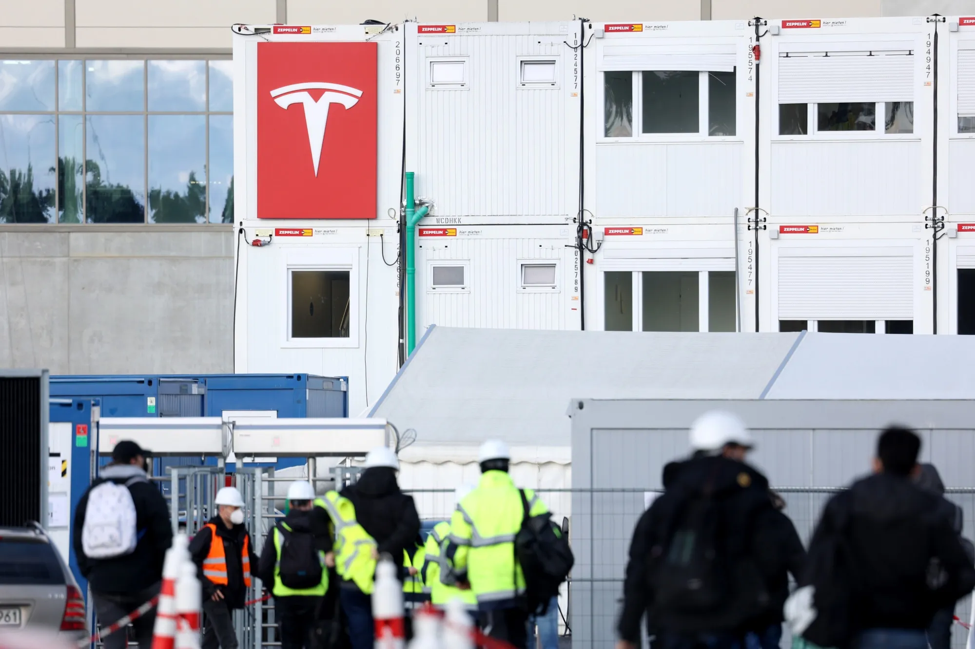 Workers at an entry gate to the Tesla Inc. Gigafactory construction site in Gruenheide earlier in February.&nbsp;