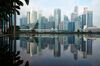 Commercial buildings in the central business district are reflected on a pond in Singapore, on Sunday, June 3, 2018. U.S. President Donald Trump and North Korean leader Kim Jong Un are due to meet in the city on June 12.
