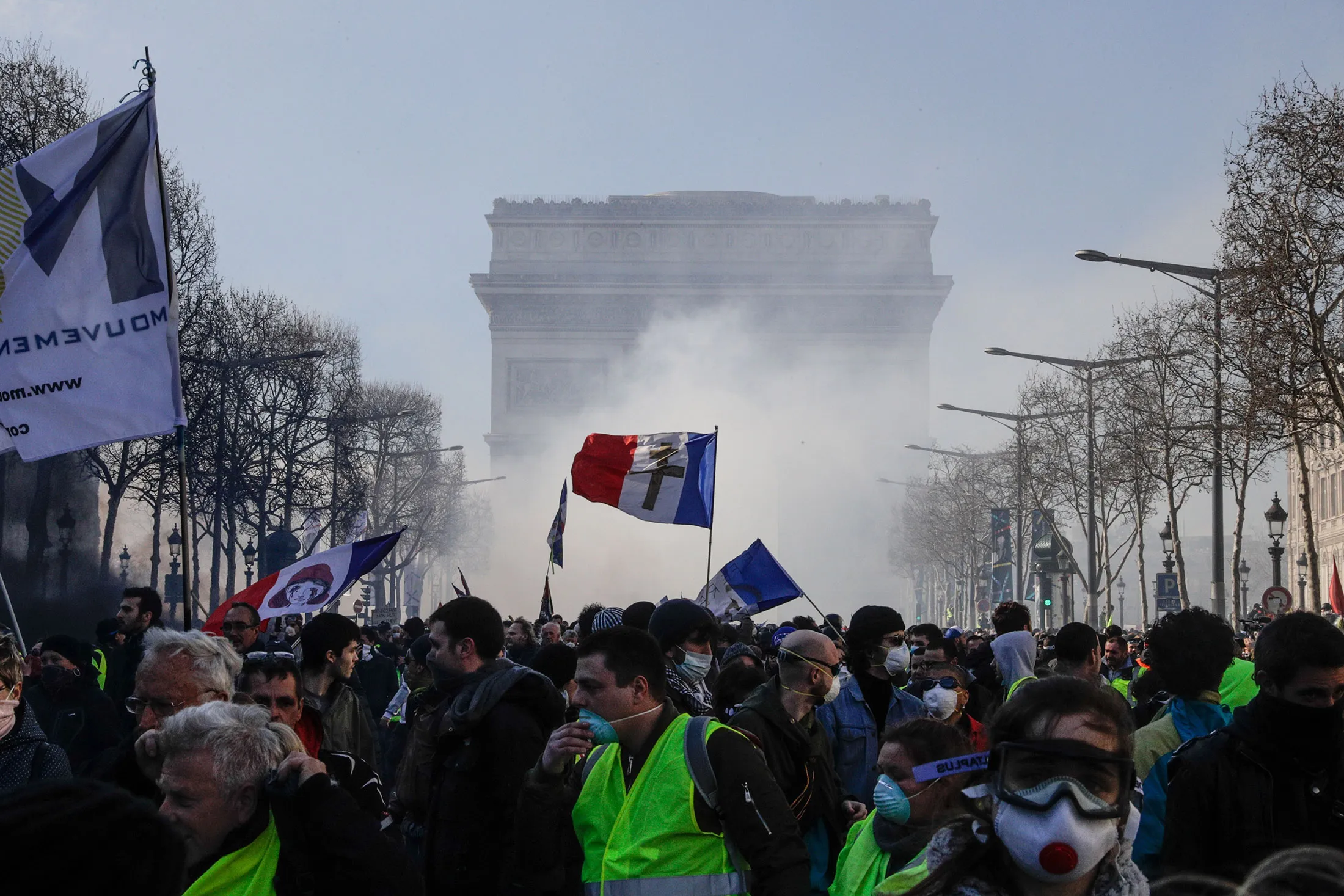 Yellow Vest protesters gather on the Champs-Elysees avenue in Paris on March 16.