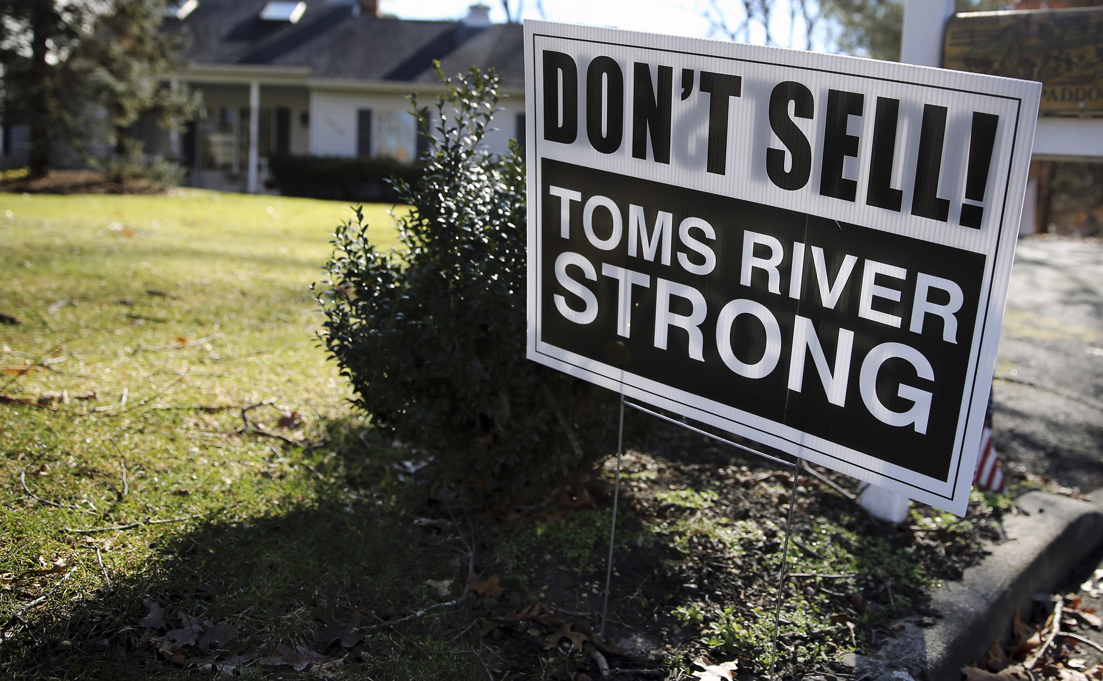 A sign sits in the front yard of a home in Toms River, New Jersey, Feb. 22.
