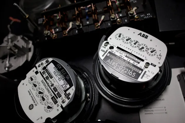 Traditional electric meters sit on a worktable in a Southern California Edison meter service center, where new 'smart' meters are being tested