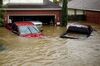 Houses and vehicles at the Highland Glen subdivision stand in floodwaters due to Hurricane Harvey.
