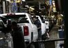 Workers inspect General Motors Co. (GM) Chevrolet 2019 Silverado HD and 2019 GMC Sierra HD pickup trucks on the assembly line at the GM plant in Flint, Michigan, U.S., on Tuesday, Feb. 5, 2019. GM is selling lots of expensive pickup trucks and sport utility vehicles in the U.S., which helped its average vehicle sales price hit a record $36,000. That played a big role in the better-than-expected quarterly earnings.