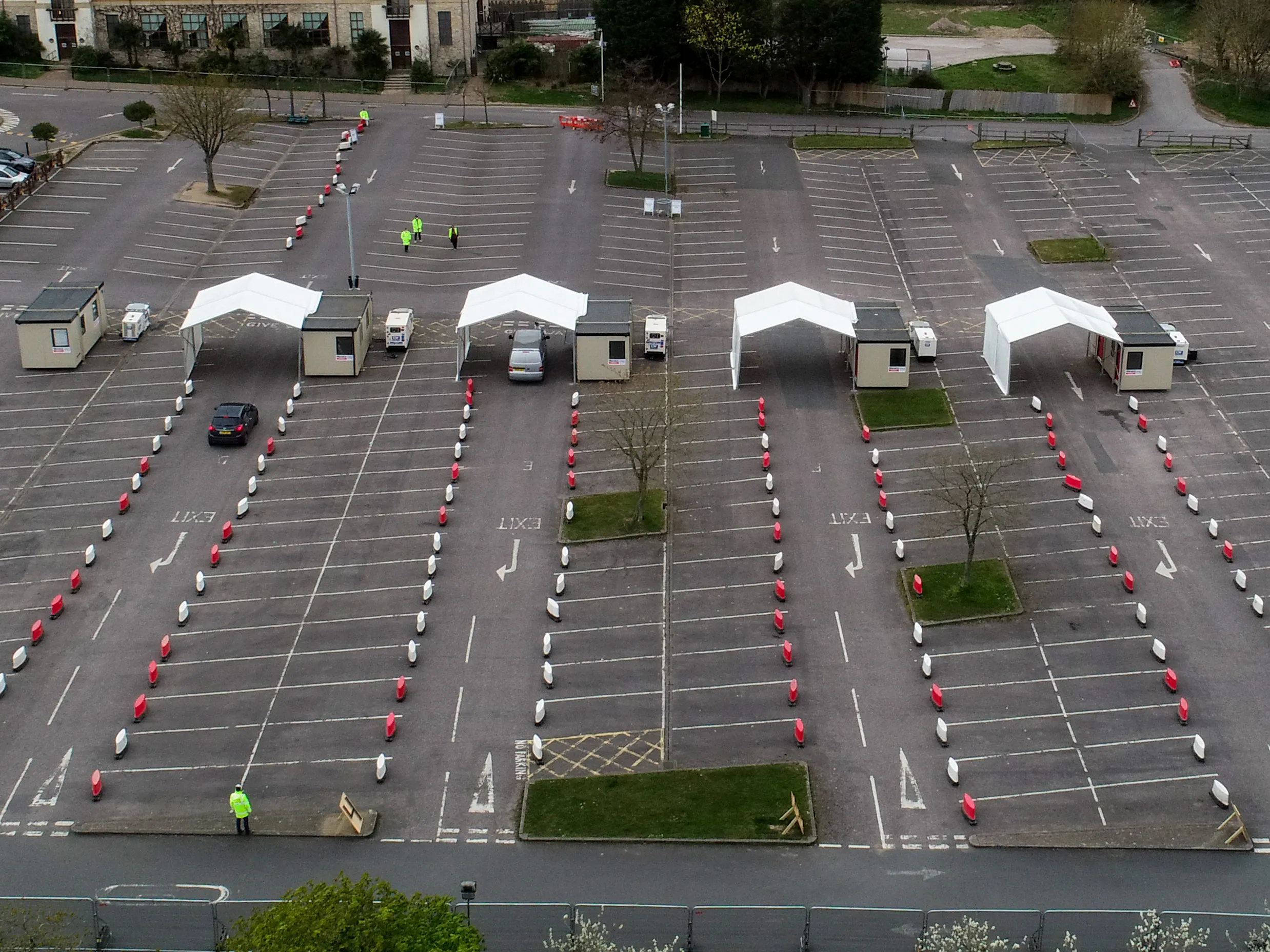 Coronavirus drive-through testing center stations stand in the car park of the closed Chessington World of Adventures Resort theme park in Chessington, on March 31.