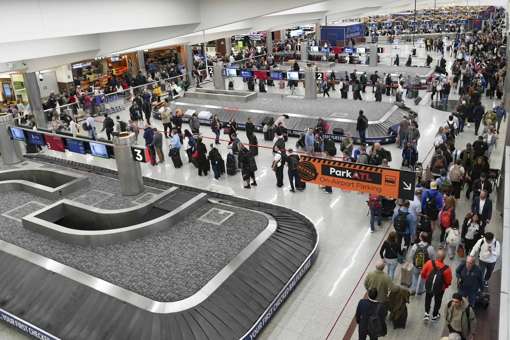 Travelers wait in line at Hartsfield-Jackson Atlanta International Airport on March 16.