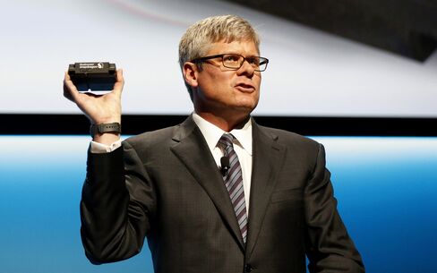 Steven Mollenkopf, CEO of Qualcomm Inc., displays the Qualcomm Snapdragon 602A processor during an event at the 2016 Consumer Electronics Show in Las Vegas, on Jan. 5.