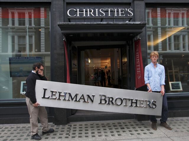Christie’s employees with a Lehman Brothers sign in London in 2010.