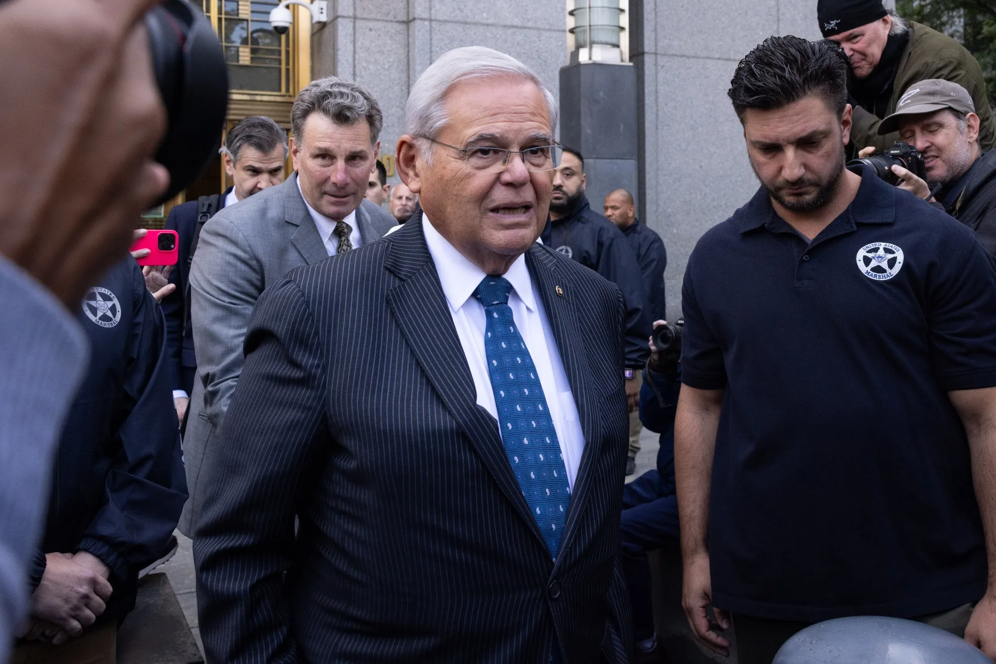 Senator Robert Menendez exits federal court in New York on Wednesday.