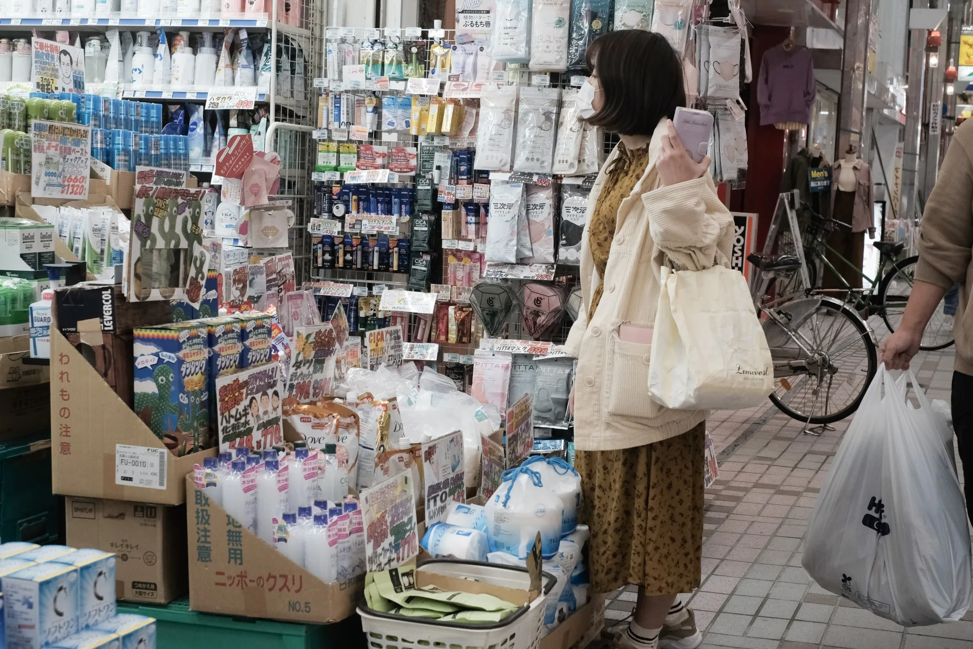 A woman browses outside a drugstore in Tokyo last year. Japan’s Takeda Pharmaceuticals is one of the global drug giants using AI to make its processes more efficient.&nbsp;