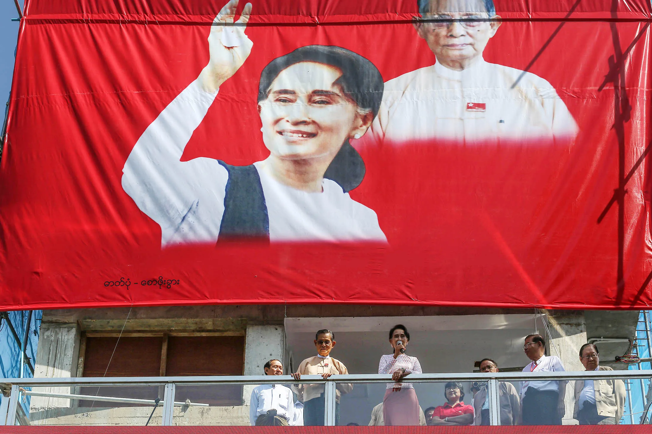 Aung San Suu Kyi delivers a speech at the party headquarters in Yangon.
