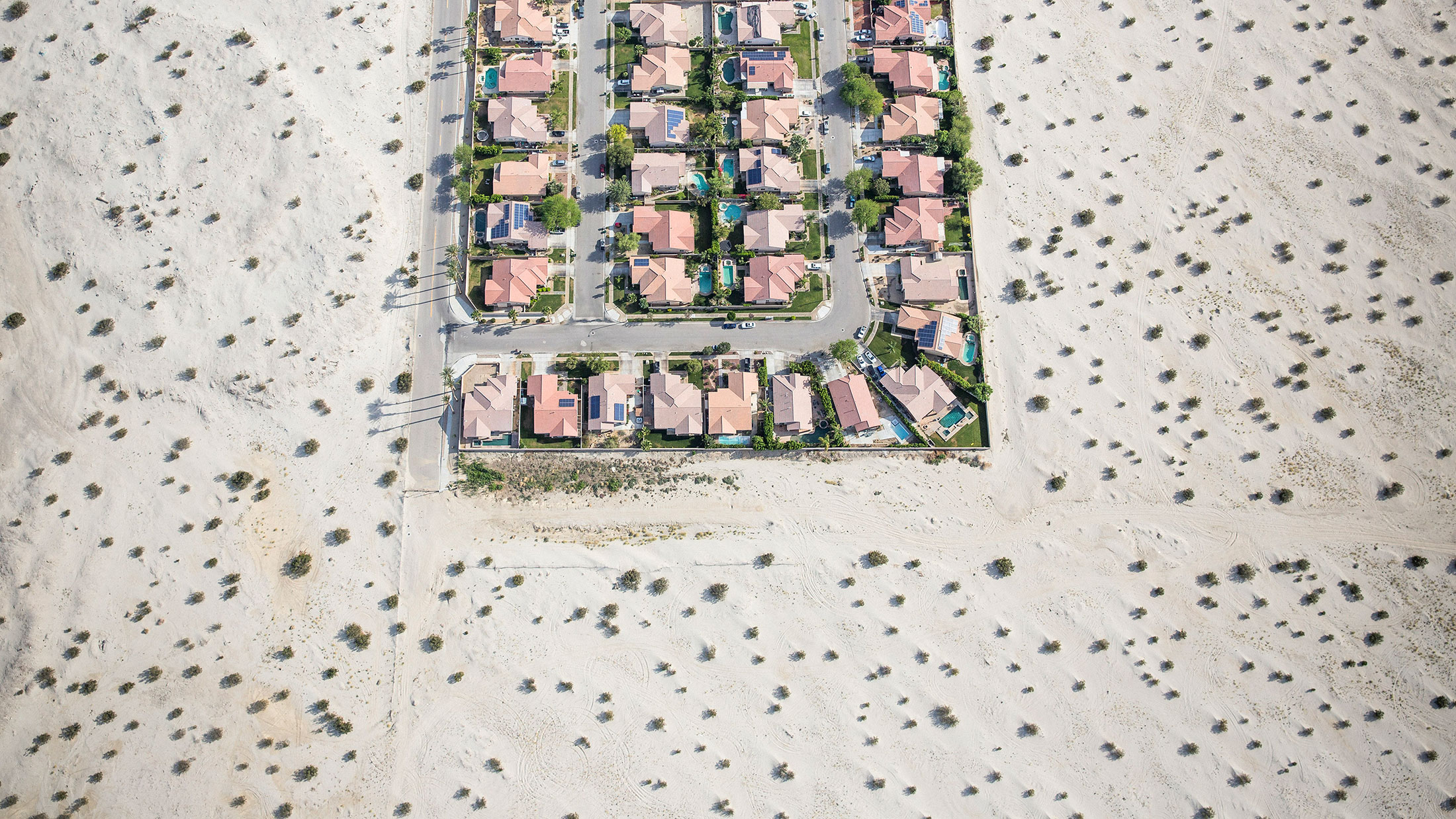 A housing development on the edge of undeveloped desert in Cathedral City, California.
