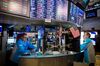 Traders work on the floor of the New York Stock Exchange (NYSE) in New York, U.S., on Friday, June 14, 2019. PetSmart Inc.-controlled Chewy Inc. surged in its first day of trading after raising $1.02 billion in an initial public offering, as investors bet that pet owners will do more of their shopping online for everything from cat food to doggy sweaters.