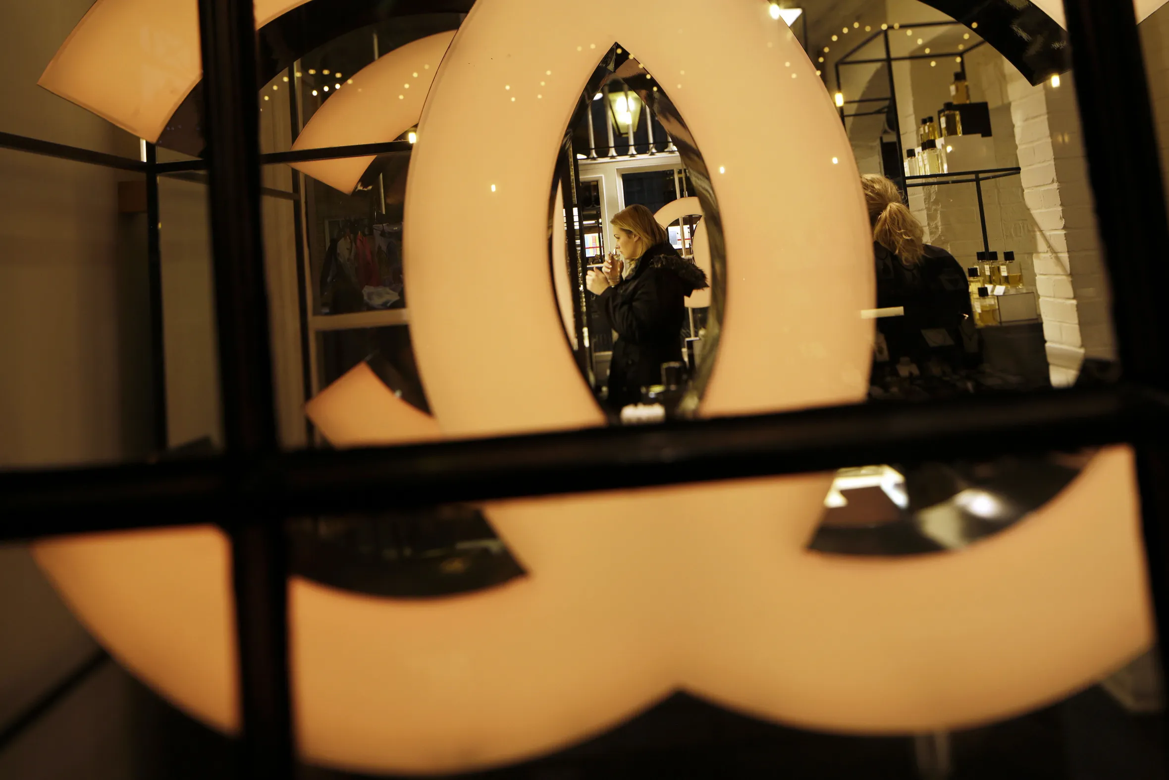 A customer samples&nbsp;perfumes inside a Chanel&nbsp;store&nbsp;in London.