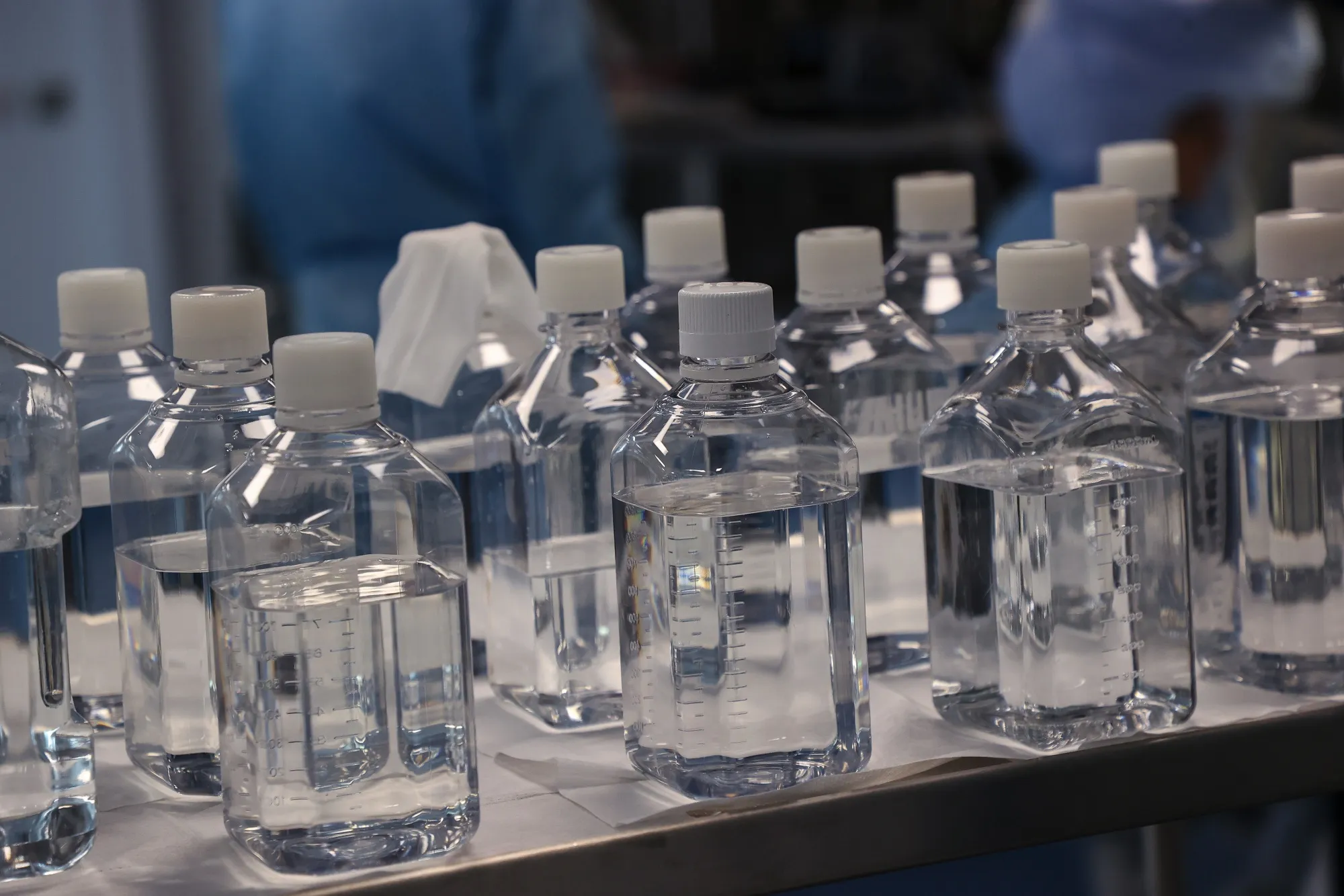 Bottles containing raw materials for messenger RNA (mRNA).