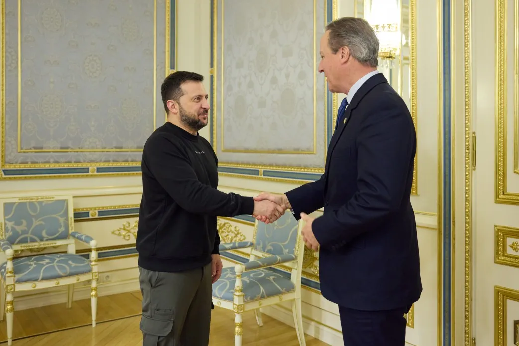 Volodymyr Zelenskiy, left, greets David Cameron in Kyiv on Nov. 16.