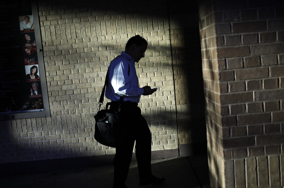 A businessman checks his phone in Charlotte, North Carolina. 