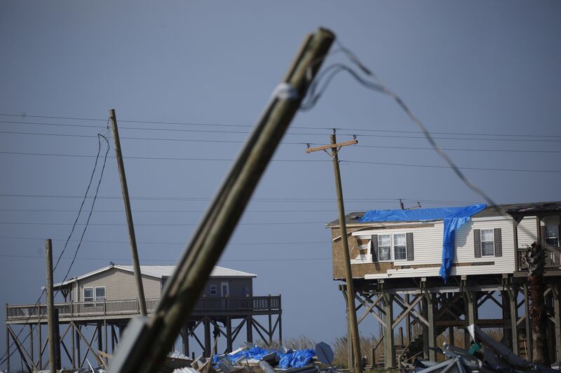 Damaged power lines and homes after Hurricane Delta made landfall in Holly Beach, Louisiana, in Oct., 2020.