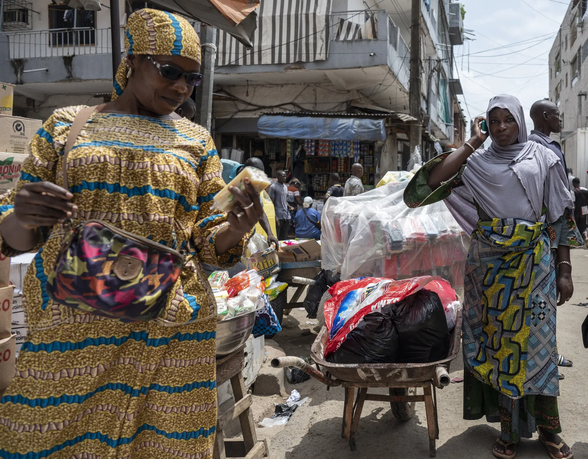 Customers at a stall at the Adjame market in Abidjan, Ivory Coast.