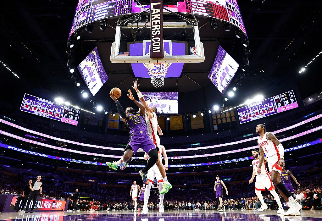 LeBron James of the Los Angeles Lakers makes a shot against Dillon Brooks&nbsp;of the Houston Rockets during a game in Los Angeles on March 31.