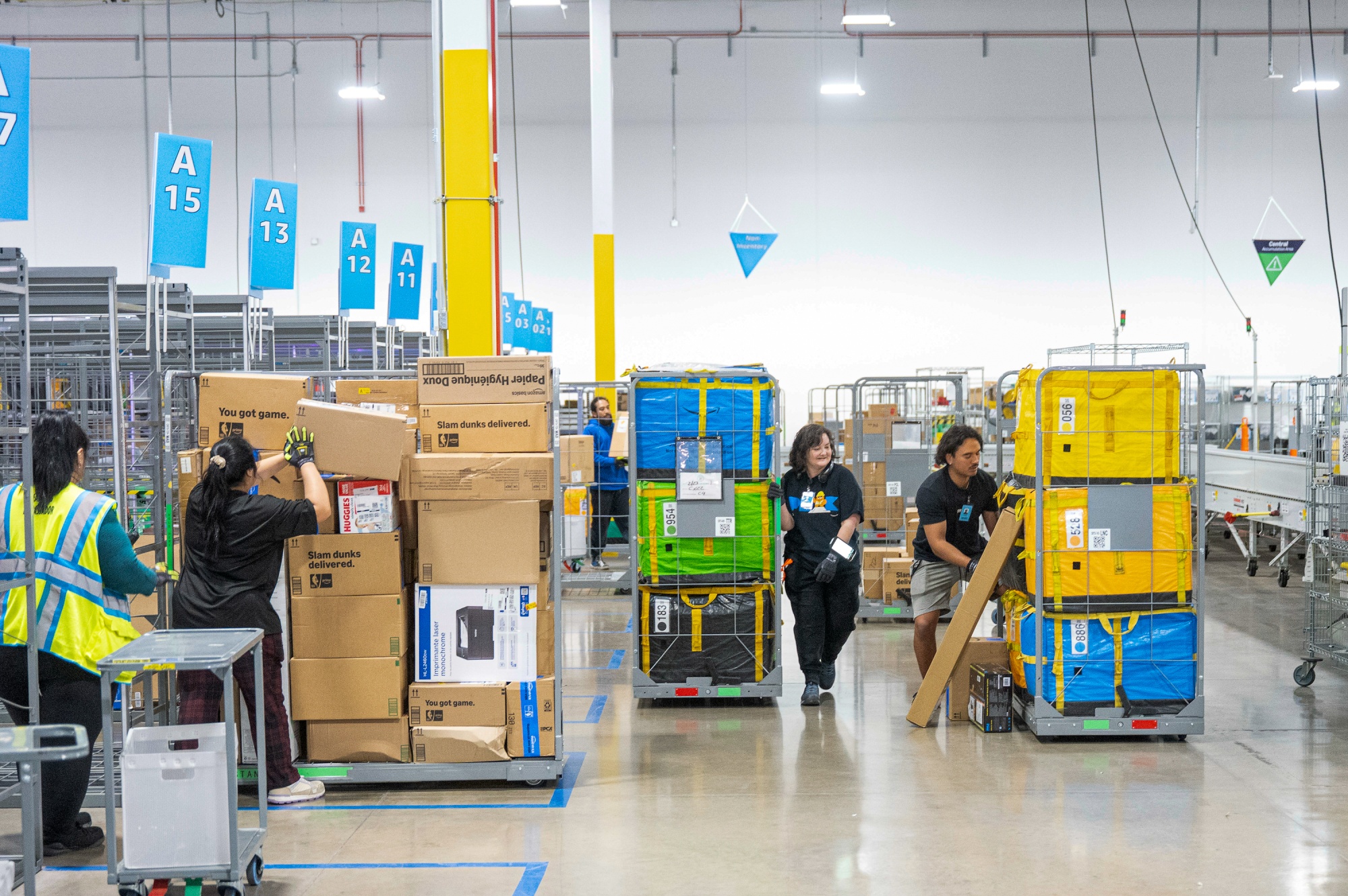 Workers sort packages at the Amazon delivery station in St George, Utah.
