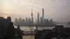 The Oriental Pearl Tower, center left, Shanghai World Financial Center, center, and the Shanghai Tower, center right, stand among other buildings in the Lujiazui Financial District along the Pudong riverside in this aerial photograph taken above Shanghai, China, on Monday, April 2, 2018. China's sprawling local government financing system needs "crucial" reforms to increase consumption, build prosperity and encourage economic rebalancing, the International Monetary Fund said.