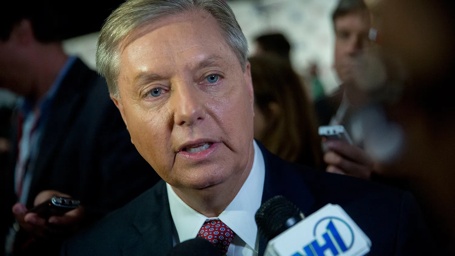 Senator Lindsey Graham, a Republican from South Carolina and 2016 Republican presidential candidate, speaks to the media in the spin area after a televised forum ahead of the first Republican presidential debate at Quicken Loans Arena in Cleveland, Ohio, U.S., on Thursday, Aug. 6, 2015.
