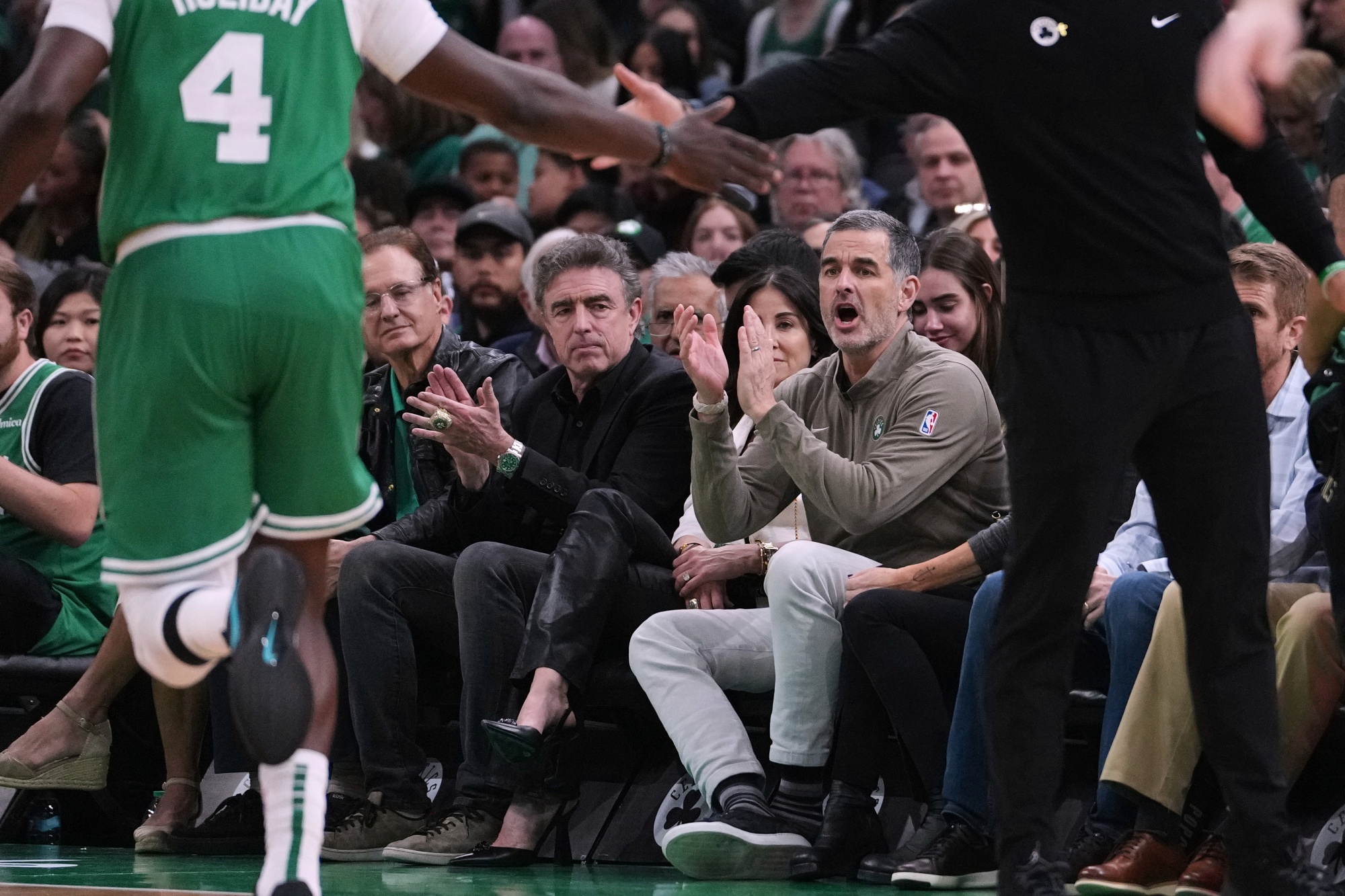 Boston Celtics owner Bill Chisholm, right, applauds during an NBA playoff game in April. Photographer: Charles Krupa&#x2F;AP Photo