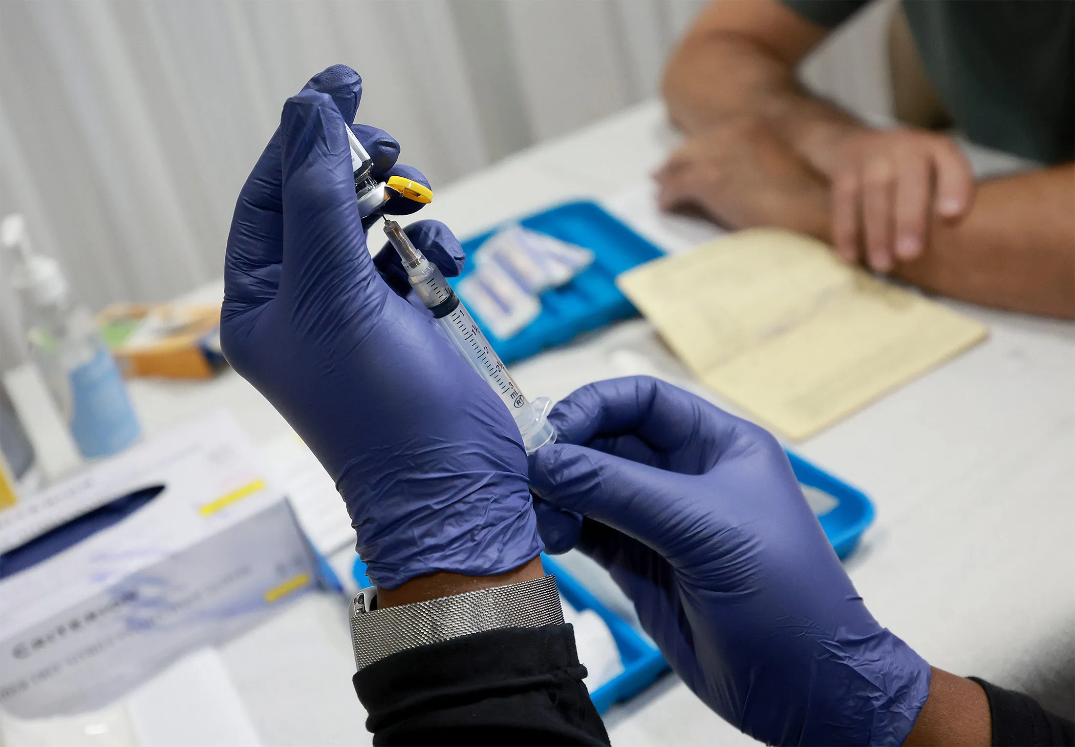 A healthcare worker prepares to administer a vaccine to a person for the prevention of monkeypox&nbsp;in Wilton Manors, Florida, on July 12.