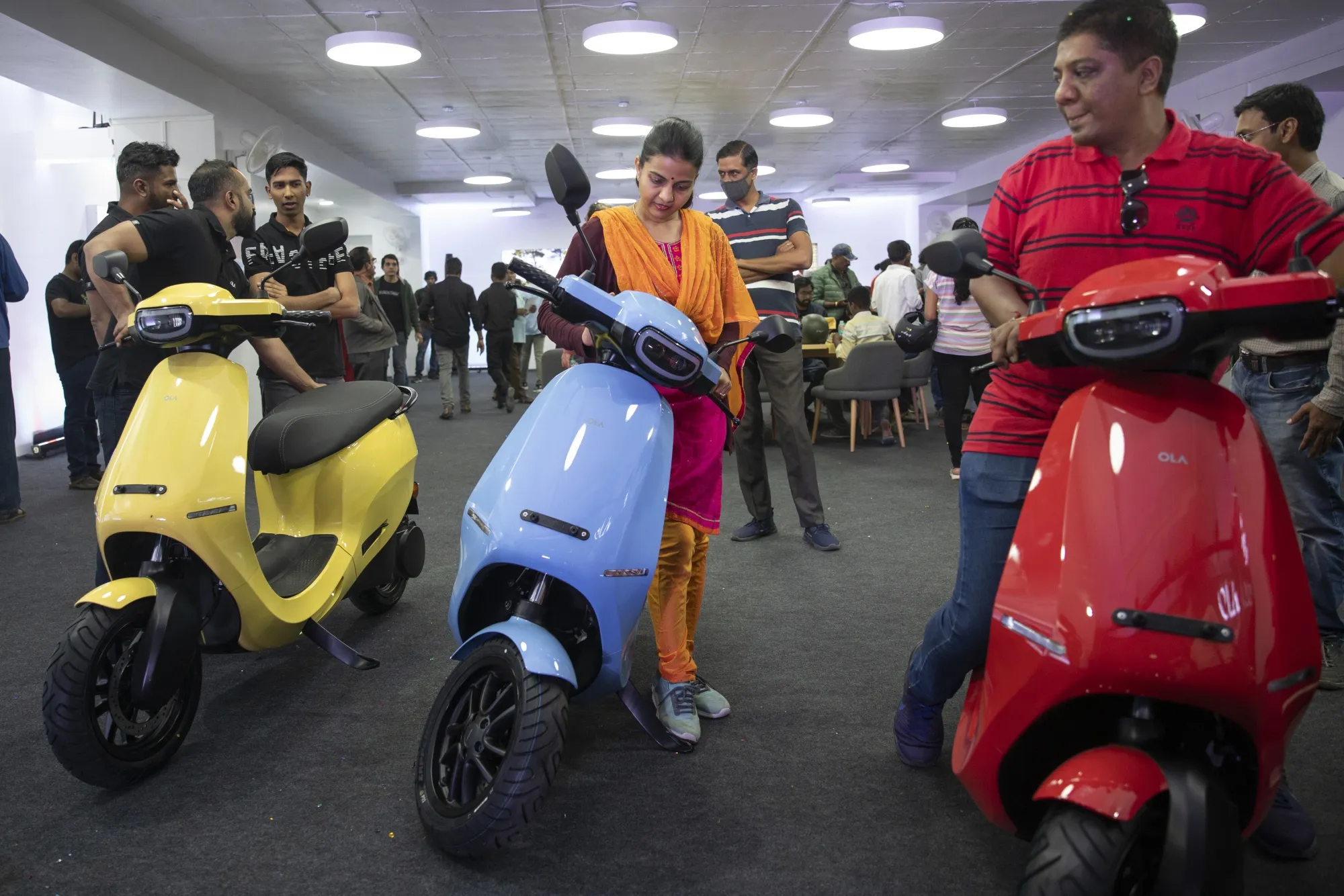 Customers test Ola S1 Pro electric scooters in Bengaluru, India.