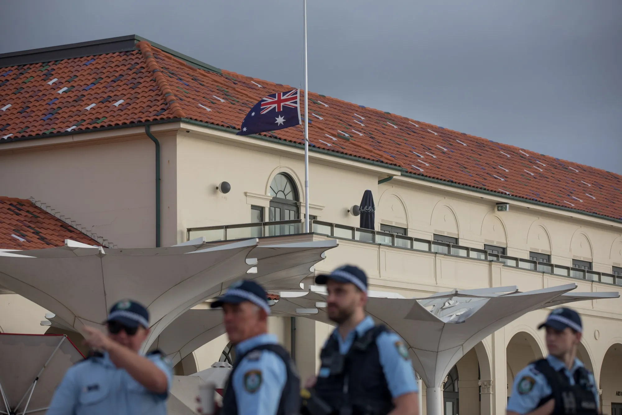 An Australian flag flies at half mast at Bondi Pavilion, following the mass shooting at Bondi Beach in Sydney on Dec. 15.