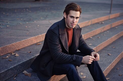 As Moore demonstrates, gray outerwear—such as this silk peacoat by Ermenegildo Zegna—makes a statement. And that statement is, "I'm not like everyone else."