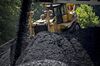 A Caterpillar Inc. D10T dozer pushes raw coal near Wylo, West Virginia.