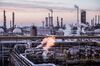 Vapour rises from oil processing and refining structures in the Duna oil refinery, operated by MOL Hungarian Oil & Gas Plc, in Szazhalombatta, Hungary, on Monday, Feb. 13, 2019. Oil traded near a three-month high as output curbs by OPEC tightened global supply while trade talks between the U.S. and China lifted financial markets.