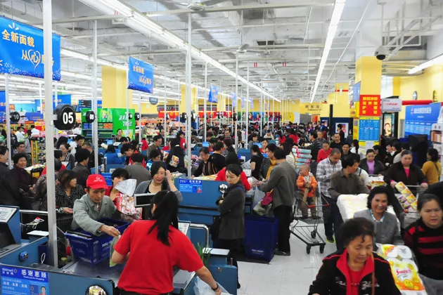 People purchase goods at a Walmart supermarket in Chongqing, China