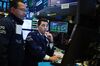 Traders work on the floor of the New York Stock Exchange (NYSE) in New York, U.S.