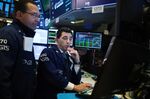 Traders work on the floor of the New York Stock Exchange (NYSE) in New York, U.S.