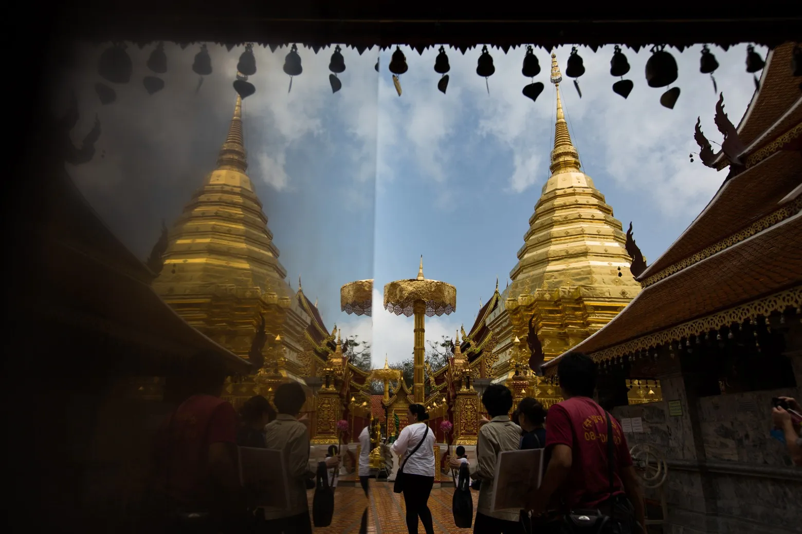 Tourists and locals visit the Wat Phrathat Doi Suthep temple in Chiang Mai, Thailand.