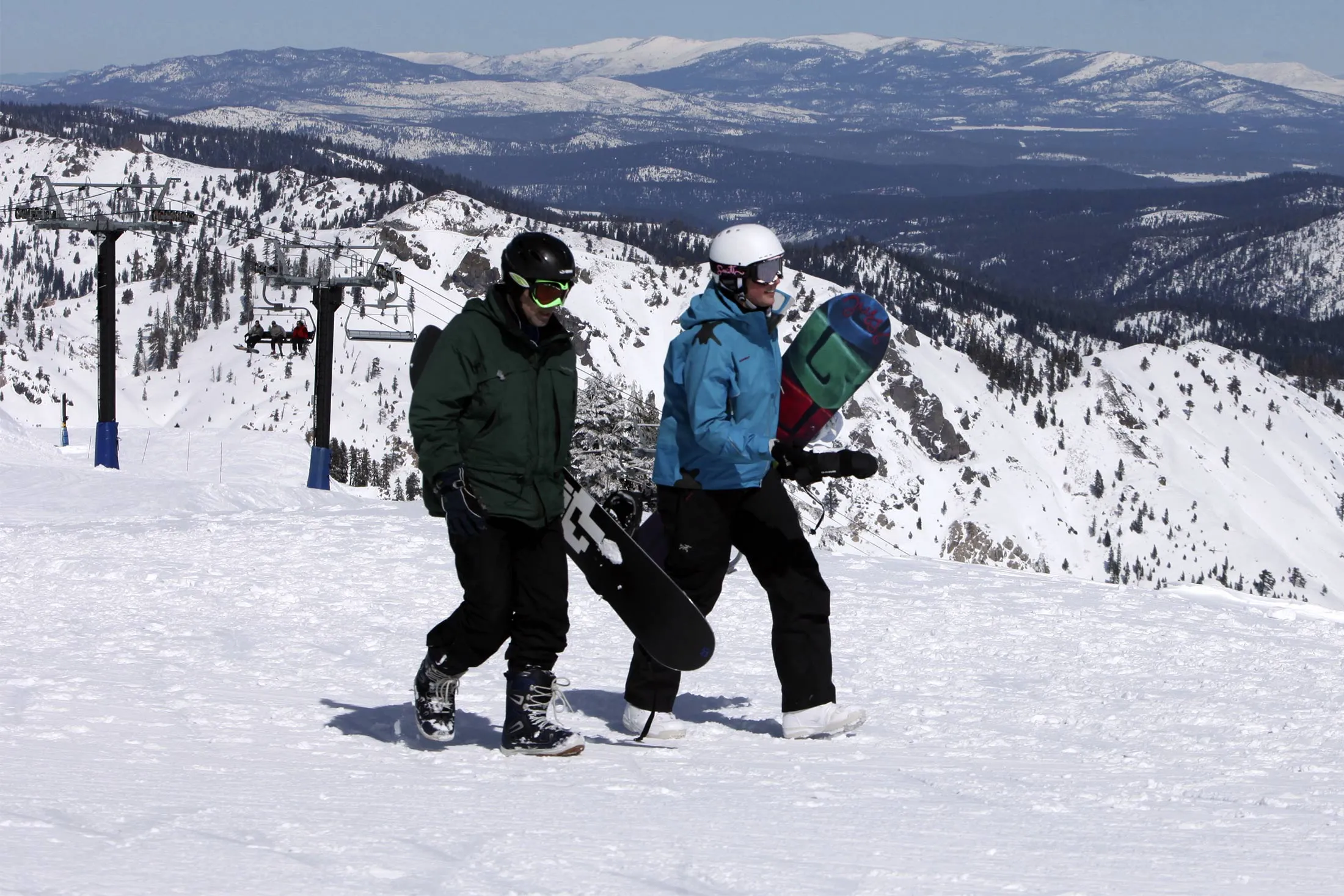 Snowboarders walk to a run at the Alpine Meadows Ski Resort in Alpine Meadows, Calif. in 2010.