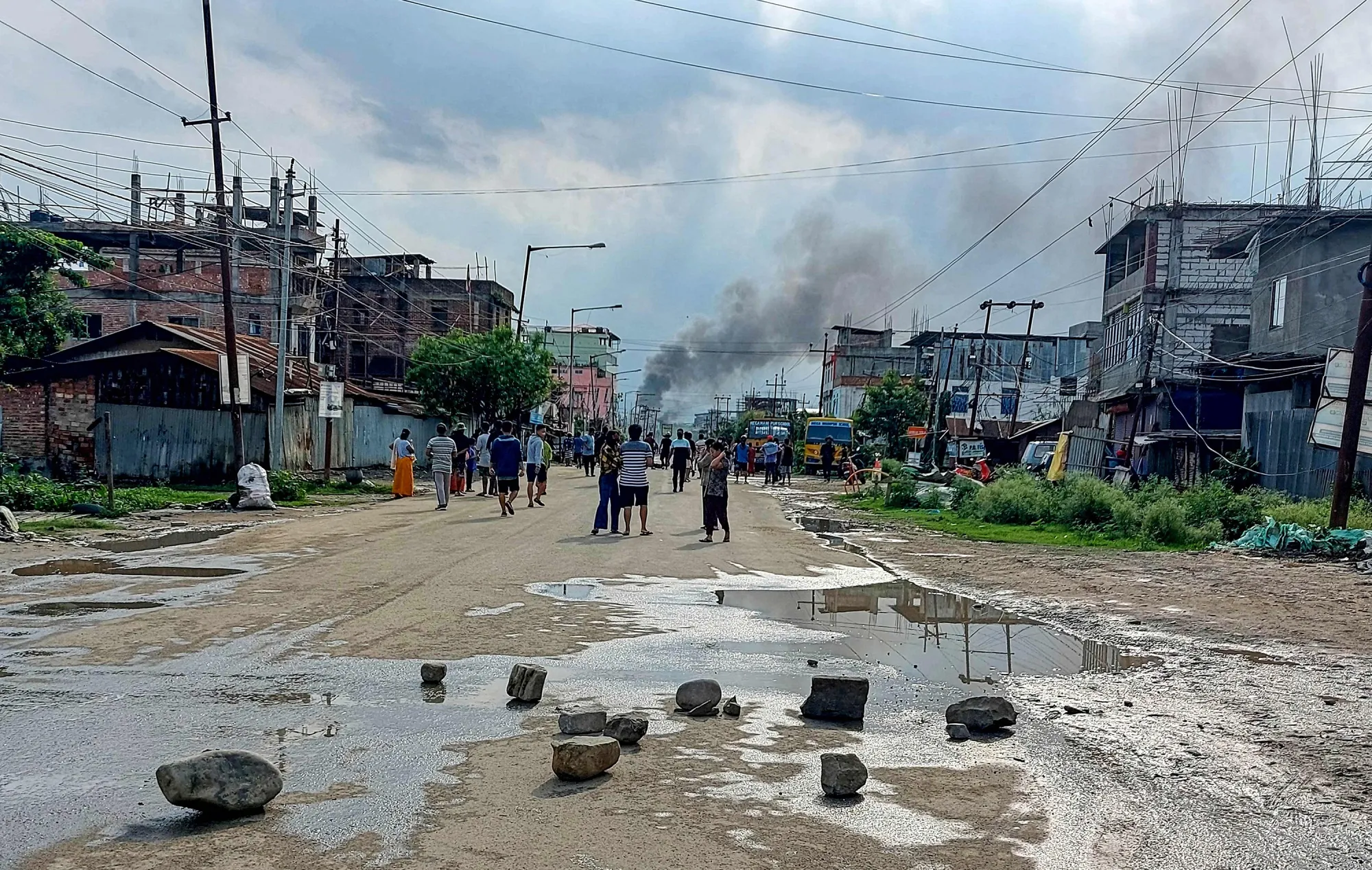 Smoke rises from a street after a standoff between a mob and security forces at Sekhon in Imphal East, in&nbsp;Manipur state, on June 15.
